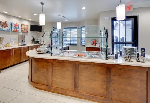 a large kitchen with a counter in a store at Staybridge Suites - San Antonio - Schertz, an IHG Hotel in Schertz
