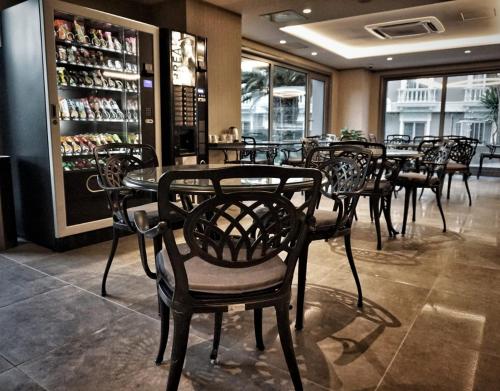 a group of tables and chairs in a restaurant at Eresin Hotels Express in Istanbul