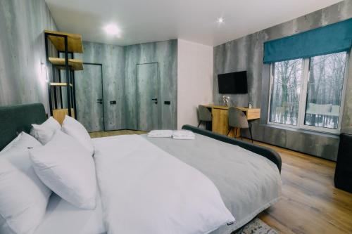 Posteľ alebo postele v izbe v ubytovaní Rado Hotel Spa