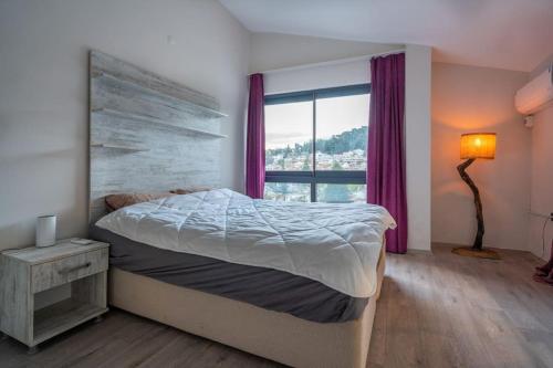 Postel nebo postele na pokoji v ubytování Tatilde Villam