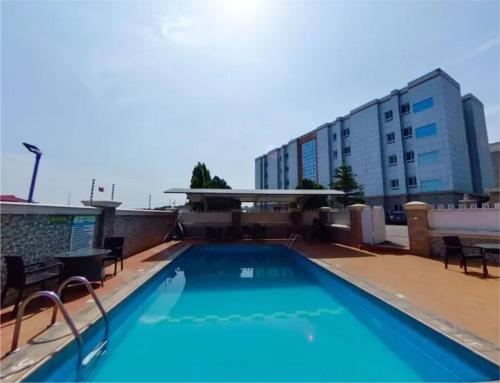 a swimming pool on the roof of a building at Newton Park Hotels Annex in Abuja