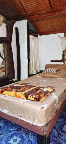 a large bed in a room with at Garden House INChiangrai in Chiang Rai