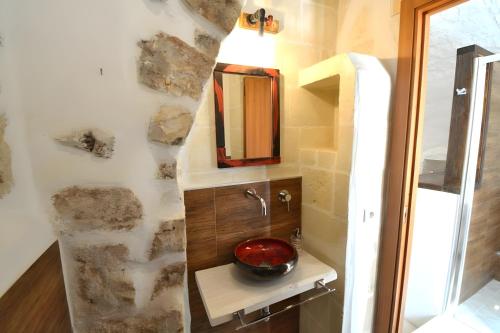 a bathroom with a sink and a mirror at Casa Matteotti by Wonderful Italy in Conversano