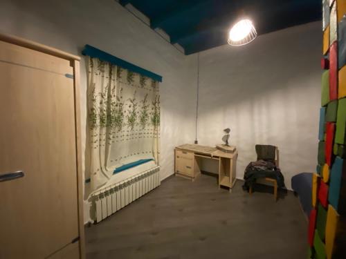 a small room with a desk and a chair at İvanovka Butik House in İvanovka