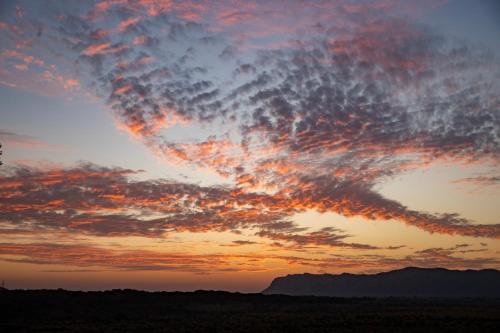 a sunset with a cloud formation in the sky at Ramgarh Lodge, Jaipur – IHCL SeleQtions in Jaipur
