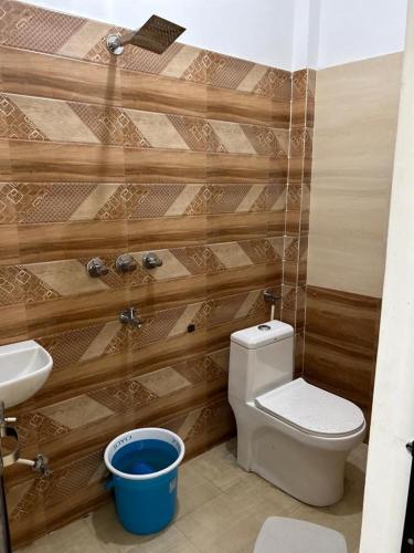 a bathroom with a toilet and a sink at Shree Ram Home Stay in Ujjain