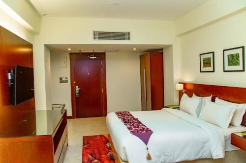 Ένα ή περισσότερα κρεβάτια σε δωμάτιο στο Hotel Grand Park Barishal