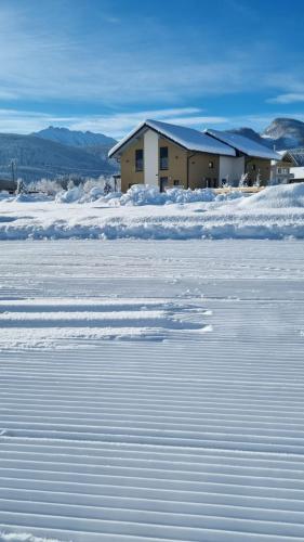 a building in the middle of a field of snow at Alpenlodge Bad Mitterndorf in Bad Mitterndorf