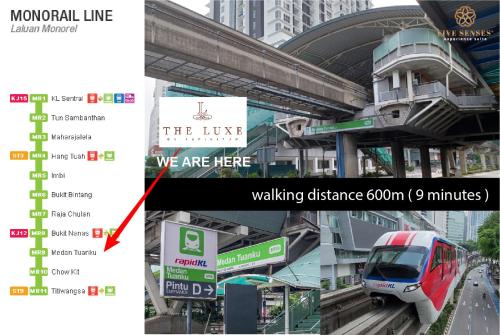 a train is on the tracks at a train station at The Colony & The Luxe Signature Suites, KLCC in Kuala Lumpur