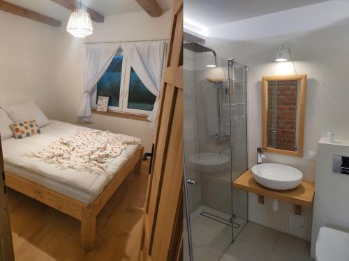 a bathroom with a bed and a shower and a sink at Zielony-Bursztyn in Objazda-Kolonia