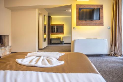 En eller flere senge i et værelse på Wellness Hotel Bulgaria