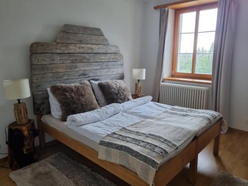 Postel nebo postele na pokoji v ubytování Hôtel Restaurant du Marchairuz