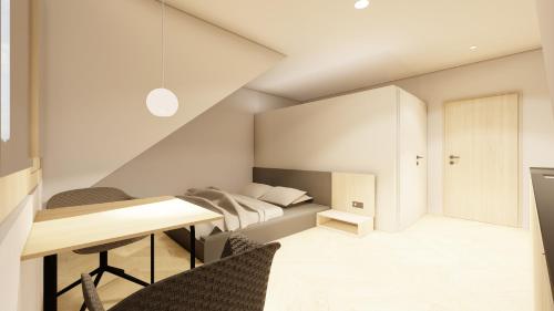 una camera con letto, tavolo e sedie di Forsthaus Apartment a Holzschlag