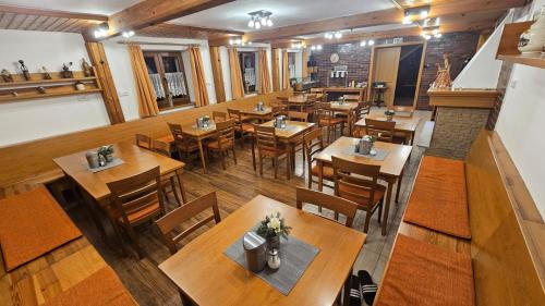 an overhead view of a restaurant with tables and chairs at Horský Hotel Sněženka in Hynčice pod Sušinou