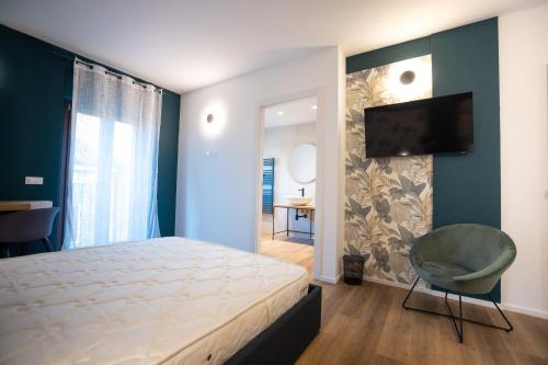 Ένα ή περισσότερα κρεβάτια σε δωμάτιο στο Mavi Rooms