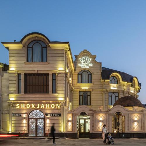 a building with people walking in front of it at Shoxjahon Hotel - 600 Mbps Internet in Tashkent