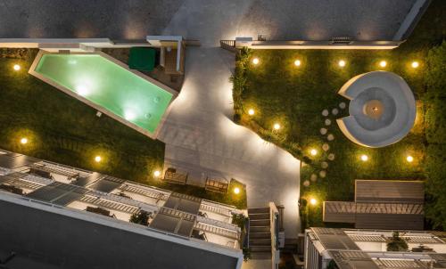 an overhead view of a swimming pool with a toilet at Eco Green Residences & Suites in Toroni