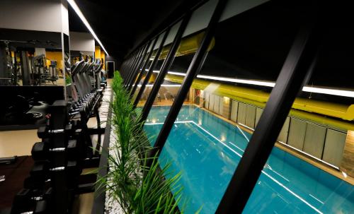 a swimming pool in the middle of a building at Fier Life Center in Kayseri