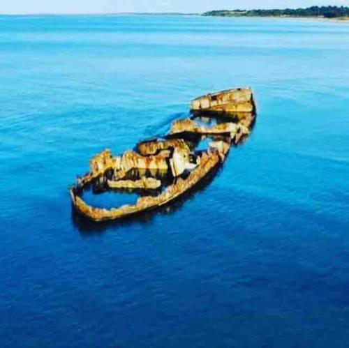a small island in the middle of the water at COZY HOLIDAY HOME by the sea in Yderby