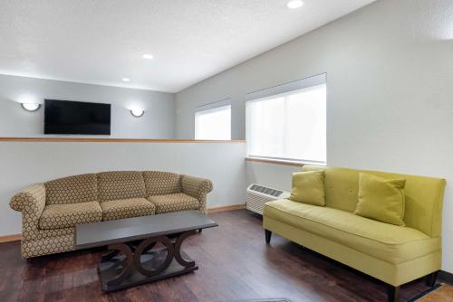 a living room with a couch and a tv at Quality Inn Bemidji in Bemidji