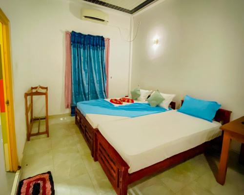 Llit o llits en una habitació de Happy Resort Yala