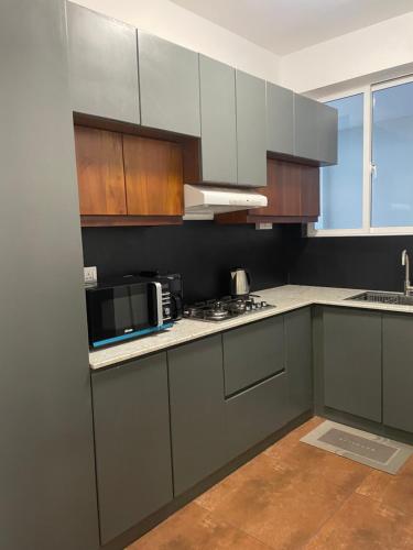 Virtuvė arba virtuvėlė apgyvendinimo įstaigoje Rush Resident Mount Lavinia