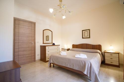 Posteľ alebo postele v izbe v ubytovaní Etna-Royal-View-Appartamento-Trilocale