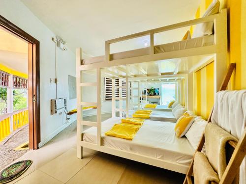 a group of bunk beds in a room at Dreamland Paradise Resort in Batangas City