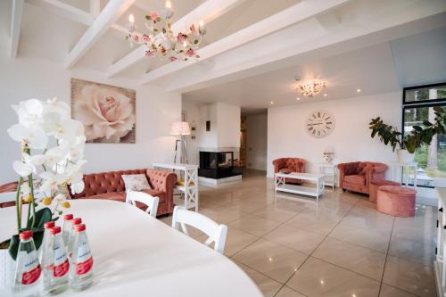 a living room with a white table and a couch at Silene Resort & Spa in Silene