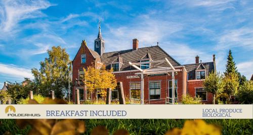a large red brick house with a tower on top at Polderhuis Bed & Breakfast in Bergschenhoek