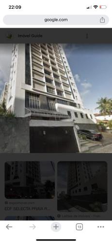 Quarto INDISPONÍVEL NO PRESENTE في ريسيفي: لقطه شاشة لصورة مبنى ابيض كبير