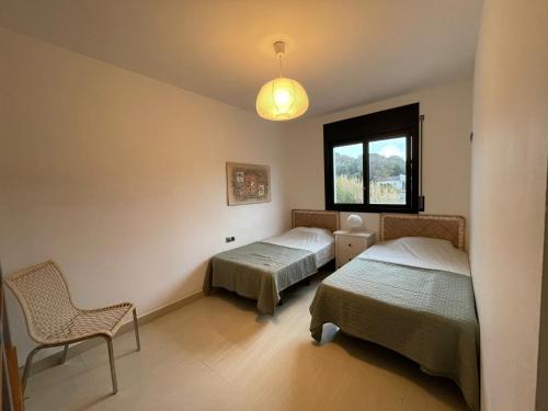 Postel nebo postele na pokoji v ubytování Villa Mas Paz