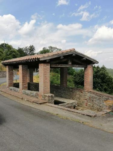 a pavilion on the side of a road at La casa di Dino ,pari in Pari