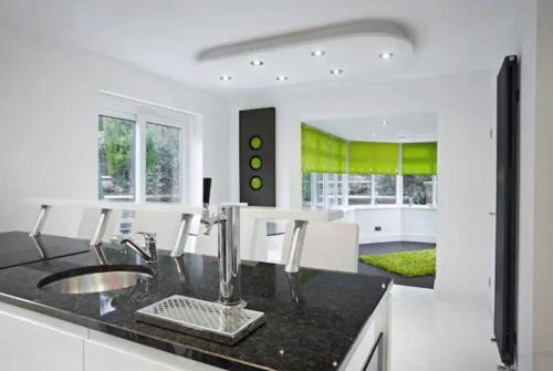 a kitchen with a sink and a counter at Eastfield Lodge with Hot Tub in Stannington