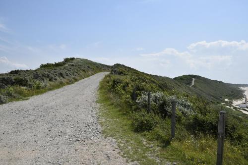 a dirt road on the side of a hill at Residentie Oosterschelde in Sint Philipsland