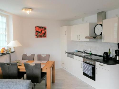 a kitchen and dining room with a table and a dining room at Ferienwohnung Eagle Nest in Winterberg in Winterberg