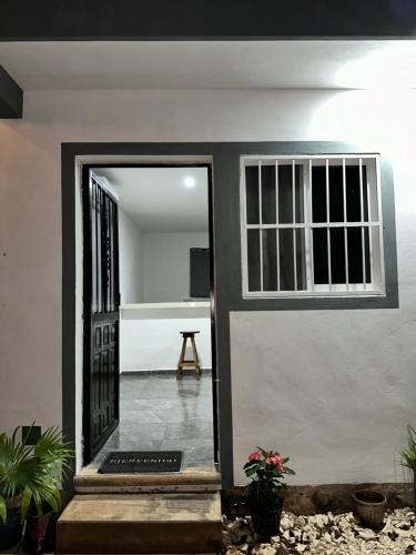 an open door of a house with a patio at Departamento 48 Street in Valladolid