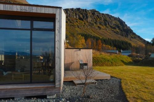 a house with a view of a mountain at Old Cottages in Höfn