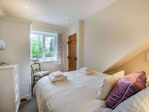 a bedroom with a bed with towels on it at 2 Bed in Satterthwaite and Grizedale LLH49 in Grizedale