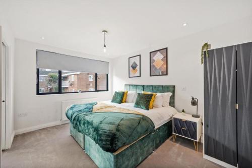 a bedroom with a bed and a window at Luxurious 5 Bed House in London - Pool Table in West Dulwich