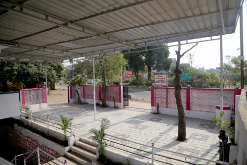 a pavilion with a tree in the middle at Daulatabad Guest House in Daulatābād