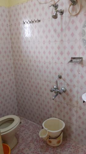 a bathroom with a toilet and a sink at K K homestay in Madikeri