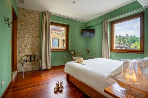 Letto o letti in una camera di Hotel Cesare