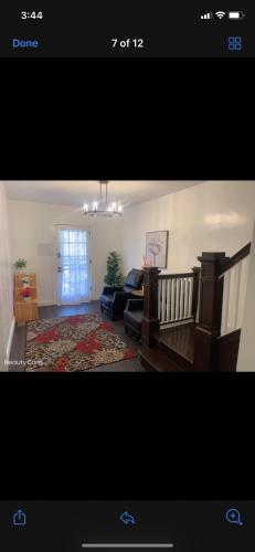 a view of a living room with a couch and a living room at NICE BEDROOM NEXT JOHNS HOPKIN UNIVERSITY in Baltimore