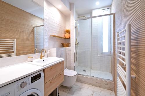 a bathroom with a toilet sink and a shower at La Maioneta Vieux-Nice in Nice