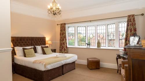 a bedroom with a bed and a window at The Oak Kelsall in Kelsall
