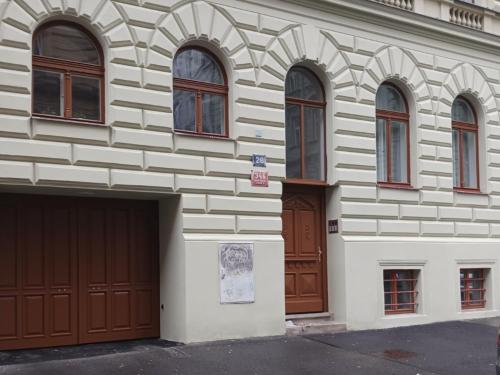 a building with two garage doors and some windows at Apartment Prague Center in Prague