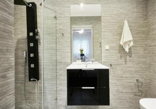 a bathroom with a sink and a shower at Luxury Villa in Kechria 2 in Kechria