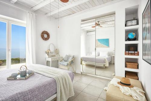 a bedroom with a bed and a view of the ocean at Luxury Villa in Kechria 2 in Kechria