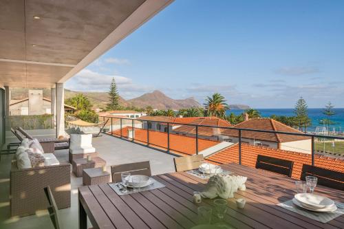 a balcony of a house with a view of the ocean at Casa da Maresia by An Island Apart in Porto Santo